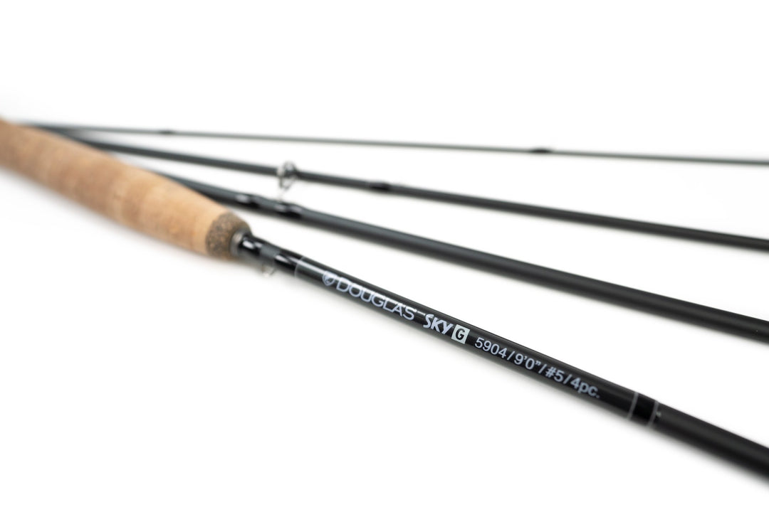 Four sections of a Douglas Sky G fly rod fanned out on white
