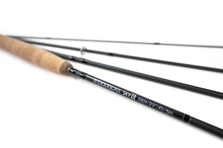 Four sections of a Douglas Sky G fly rod fanned out on white