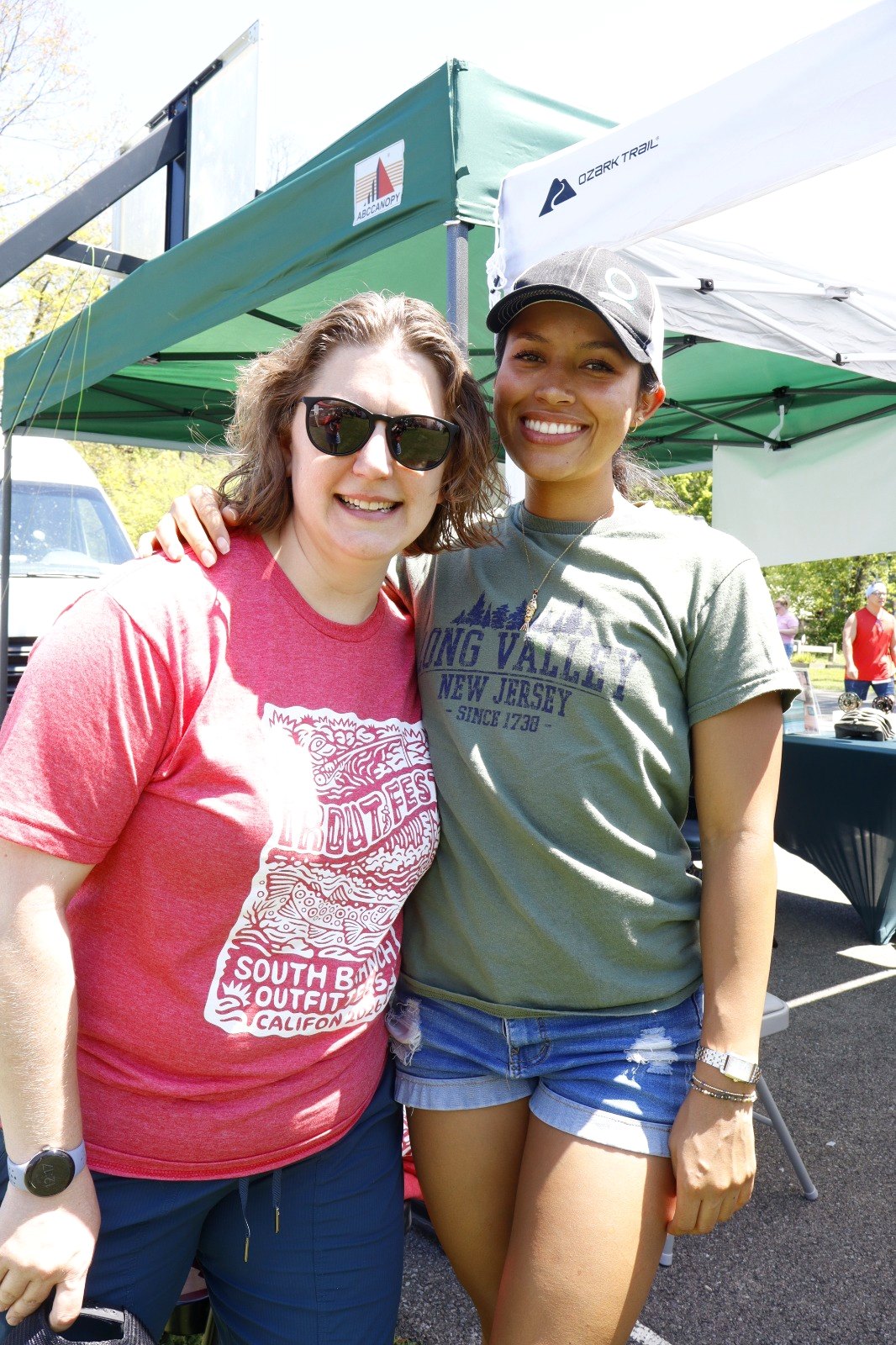 Two attendees in Trout Fest and Long Valley t-shirts