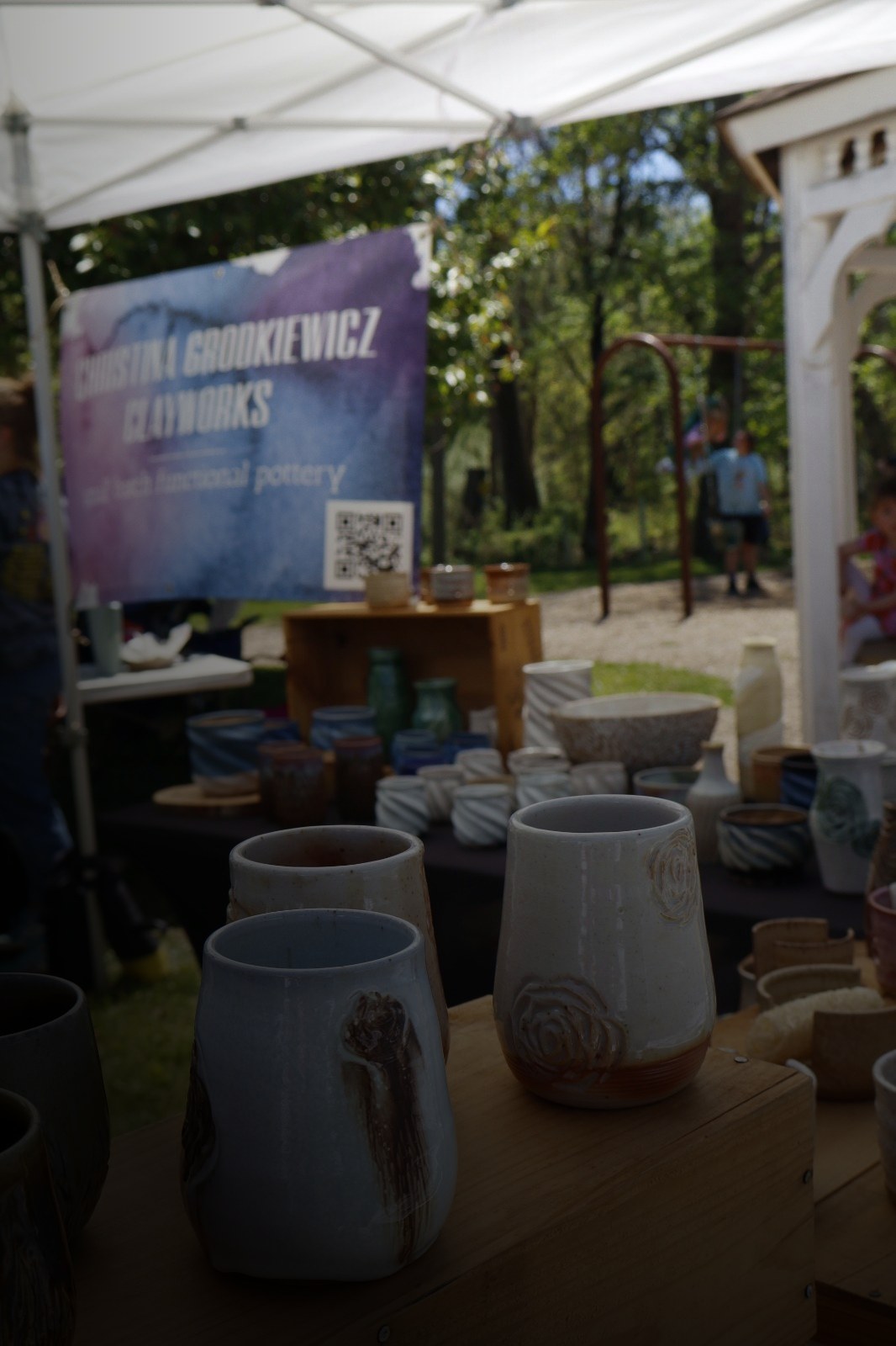 Handmade pottery on a maker's table at Trout Fest