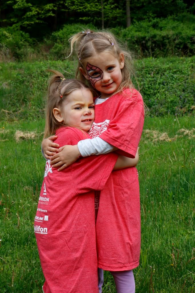 Two young Trout Fest attendees in event t-shirts