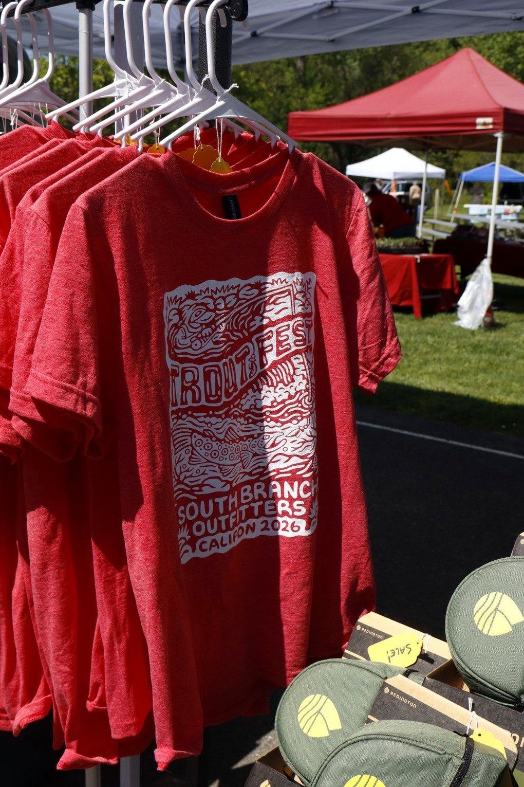 Trout Fest event t-shirts on the rack